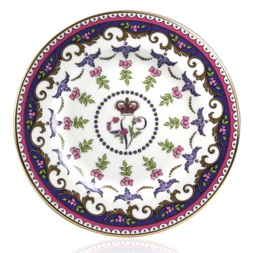 Queen Victoria side plate with design featuring Queen Victoria's name cipher surrounded by floral patterns and gold plated rim.