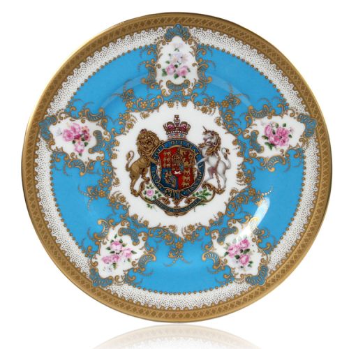 Royal coat of arms English fine bone china salad plate with gilded rims and featuring a lion and unicorn royal crest surrounded by ornated gold patterns and English flower patterns on a blue coloured background. 