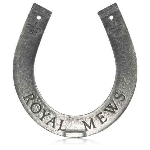 Royal Mews metal horseshoe with the words Buckingham Palace and royal crowns engraved on the back side and Royal Mews engraved on the front side.