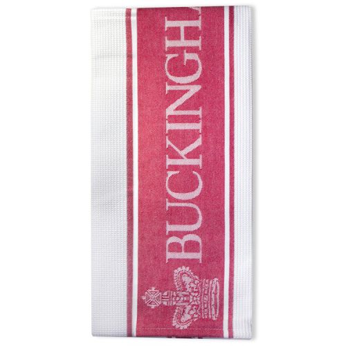 White waffle tea towel with red stripes. Middle red stripe has 'Buckingham Palace' written in white and crowns either side. 