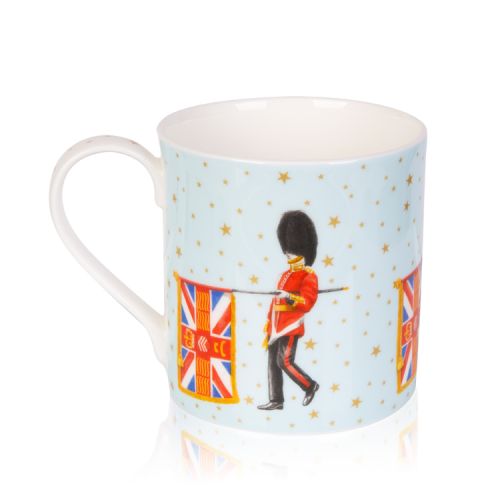 Pale blue mug decorated with guardsmen and flag. On the blue background are gold stars and on the inside of the mug is the gold coronet