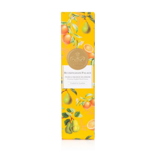 Silver tube decorated with orange design of the ingredients and a silver crown in the middle of the tube