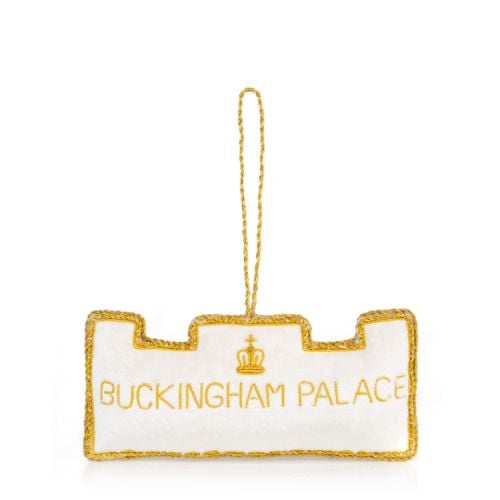 Front facade of Buckingham Palace made of white velvet. Gold embroidery detail and crystals.