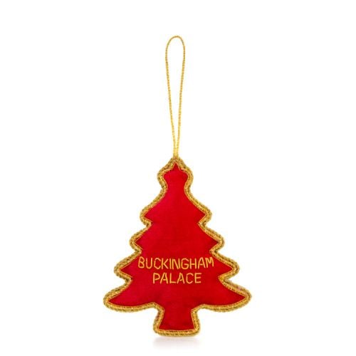 Green Christmas tree-shaped decoration. topped with a crown and embellished with gold beads and red crystals.