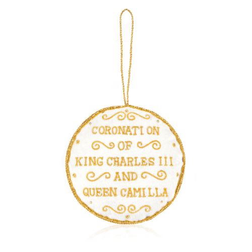 White decoration with blue and gold stitching. Joint cypher of their majesties at the centre and the date of the coronation at the bottom.