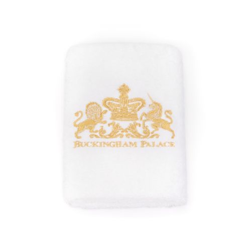 Face cloth with Lion and Unicorn crest in gold thread.