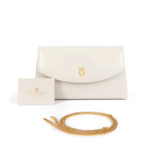 A white leather clutch bag with gold plated logo and fold over