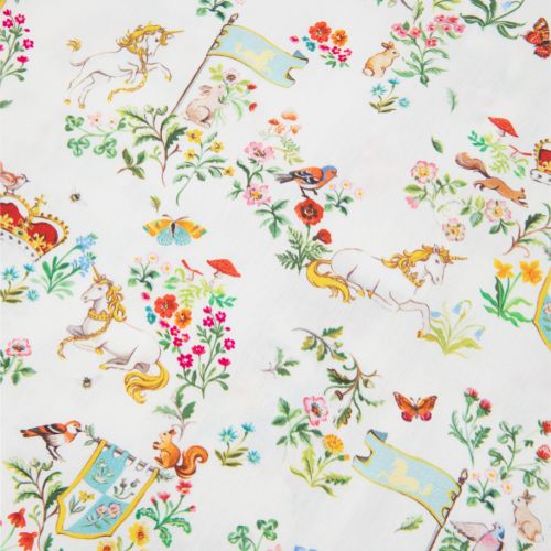 Front of unicorn button down pyjamas with floral forest scene featuring unicorns, crowns, rabbits and flags.