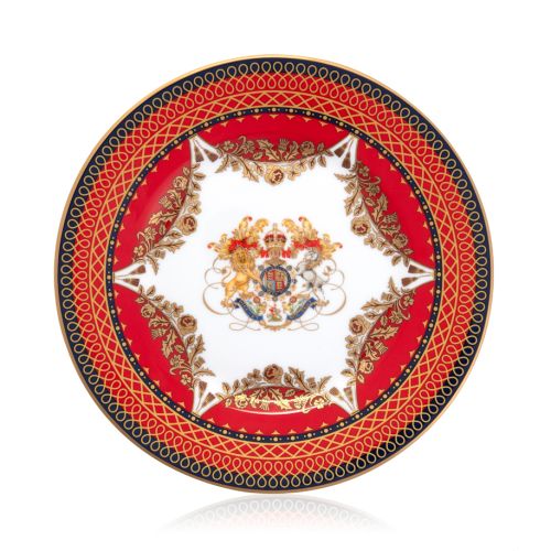 The Livery 8" Dessert Plate featuring the Royal crest at its centre and ornate  and a deep, rich scarlett edge and navy border with contrasting fine gold details, inspired by the intricate decorative braiding of hand-sewn livery and regimental devices of 