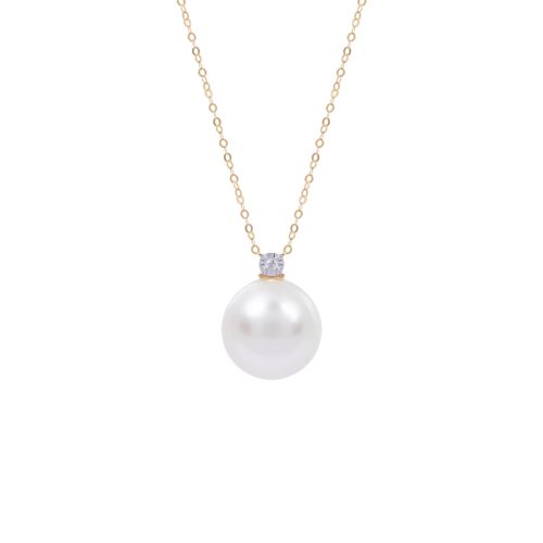 Delicate gold chain with small diamond connected to large South Sea pearl. 