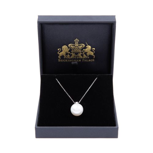 Delicate silver coloured chain with a small diamond connected to large South Sea Pearl. 