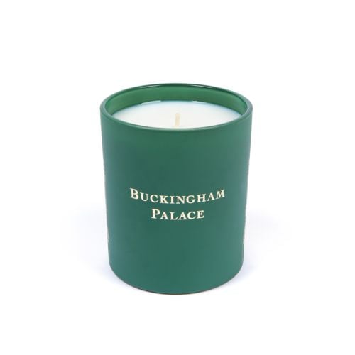 Green lit candle with Buckingham Palace Facade on front.