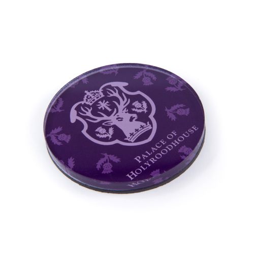 Purple Palace of Holyrooodhouse magent with royal Scottish thistle and Scottish insignia.