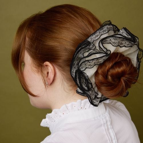 Ivory with black lace detail scrunchie on model. 