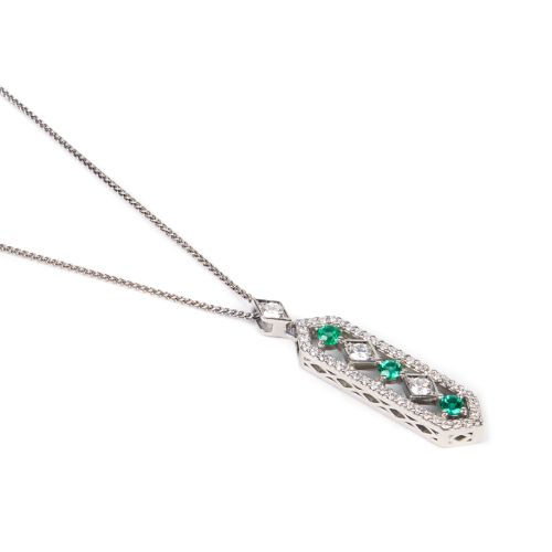 The Girls of Great Britain and Ireland Limited Edition Emerald and Platinum Pendant, featuring three emeralds. 
