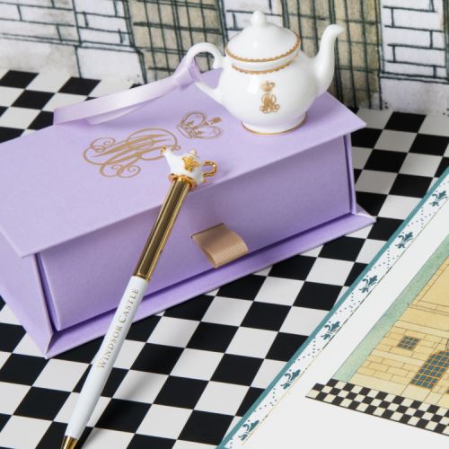 white and gold pen with teapot topper.