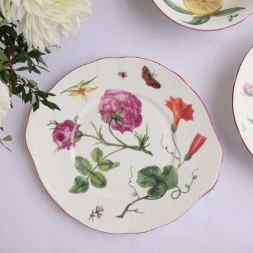 Chelsea Porcelain Salad plate on a table with flowers and other plates from the range. 
