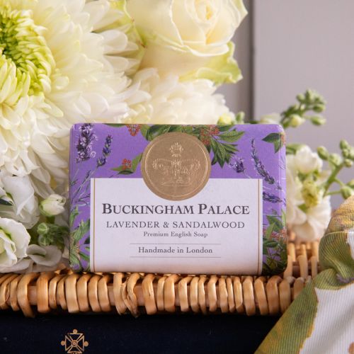 The From the Palace Garden Hamper featuring Chelsea Garden Gloves Set of 2 and Chelsea Garden Utility Belt with a botanical print featuring insects, lemons, and leaves with green and purple detailing. Also featured is the Buckingham Palace Lavender and S