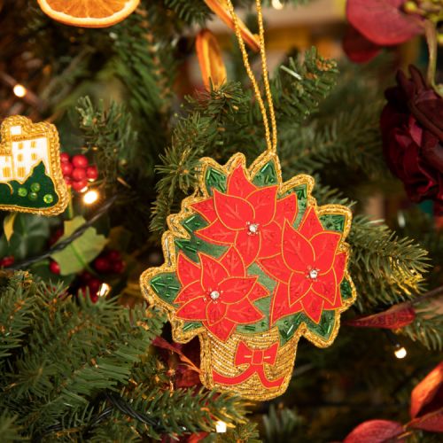 Three Poinsettias in a festive basket. Embroidered with beads and outlined with gold thread.